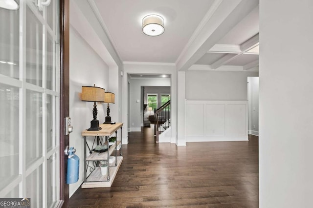 foyer entrance featuring stairway, ornamental molding, and wood-type flooring
