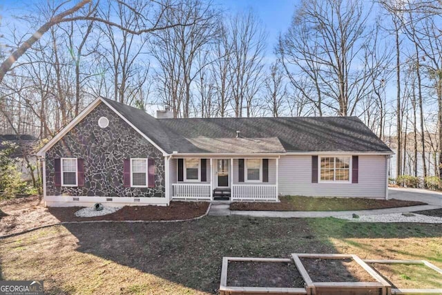 rear view of property featuring a garden, a chimney, crawl space, a porch, and a yard