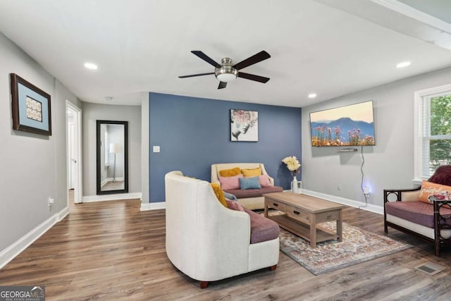 living room with baseboards, recessed lighting, ceiling fan, and wood finished floors