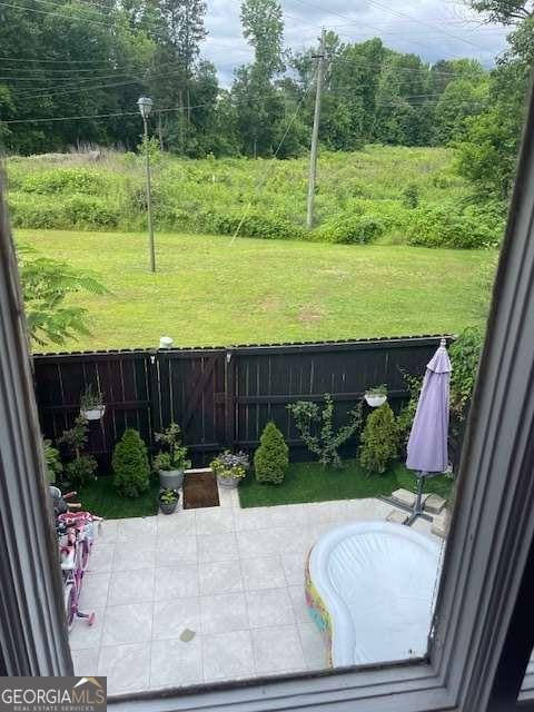 exterior space featuring a fenced backyard and a patio area