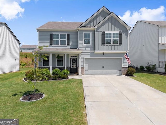 craftsman-style house with board and batten siding, driveway, a front lawn, and a garage