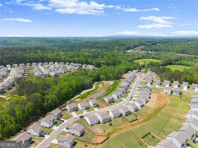 aerial view featuring a residential view and a forest view