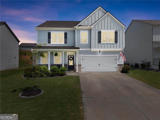 view of front facade with board and batten siding, an attached garage, concrete driveway, and a front yard