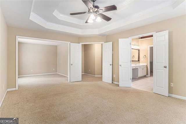 1235 Legend Run, Alpharetta, GA 30005 - unfurnished bedroom featuring crown molding, light colored carpet, a raised ceiling, ensuite bathroom, and a ceiling fan
