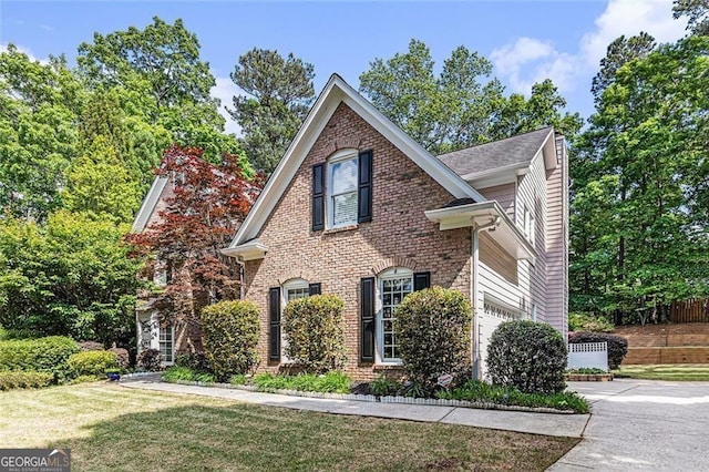 1235 Legend Run, Alpharetta, GA 30005 - traditional-style house featuring brick siding, a garage, a front lawn, and concrete driveway