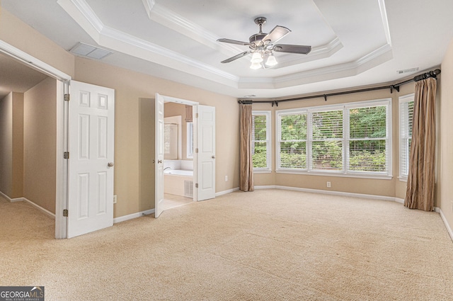 unfurnished bedroom with ornamental molding, carpet, and visible vents