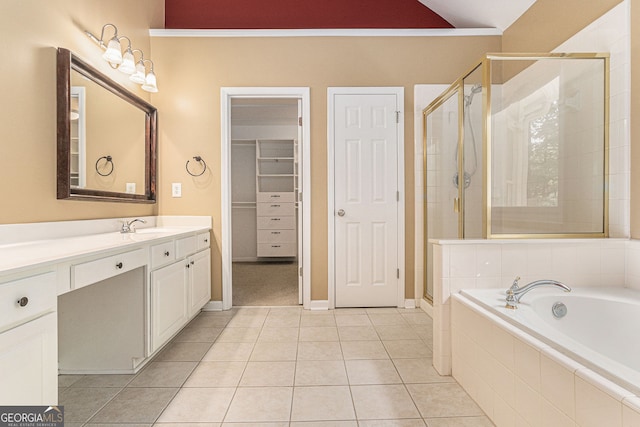 full bathroom with vanity, a bath, tile patterned floors, and a shower stall