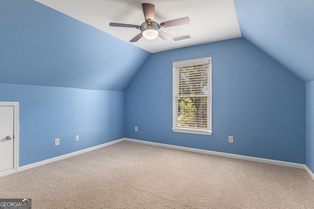 bonus room featuring visible vents, a ceiling fan, lofted ceiling, and carpet flooring