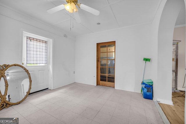 415 Scenic Dr, Toccoa, GA 30577 - unfurnished room with arched walkways, a ceiling fan, and ornamental molding