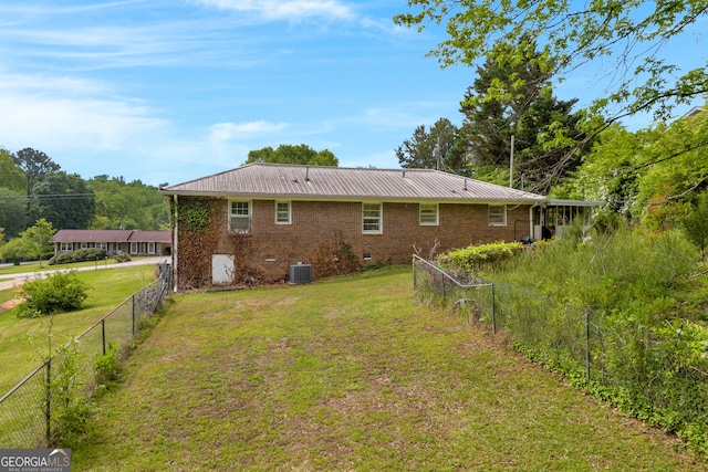 415 Scenic Dr, Toccoa, GA 30577 - back of house with a fenced backyard, a metal roof, and brick siding