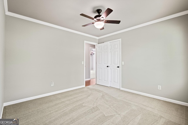 760 Swan Ln, Canton, GA 30115 - unfurnished bedroom featuring ornamental molding, carpet flooring, a closet, and ceiling fan