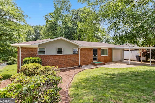 ranch-style home featuring brick siding, an attached garage, and a front yard