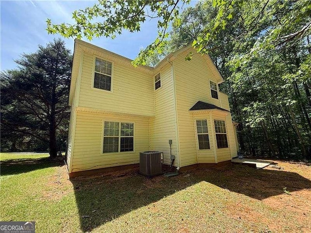 99 Ashtonbrook Dr, Mcdonough, GA 30252 - back of house featuring a yard and cooling unit