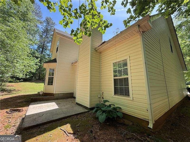 99 Ashtonbrook Dr, Mcdonough, GA 30252 - view of side of property with a patio and a chimney