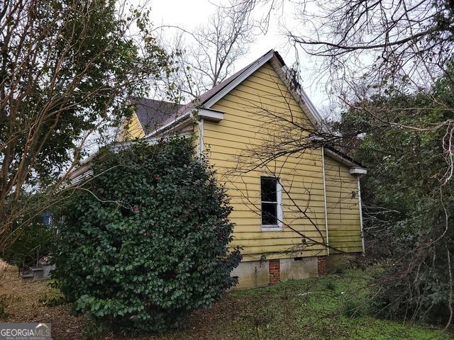 803 S Jefferson St, Dublin, GA 31021 - view of side of home with crawl space