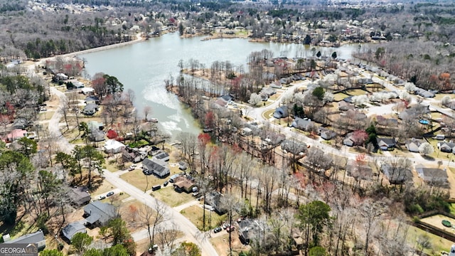 bird's eye view featuring a water view and a residential view