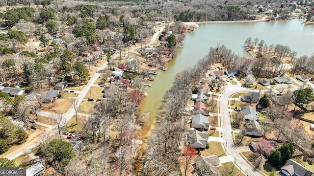 birds eye view of property with a residential view and a water view