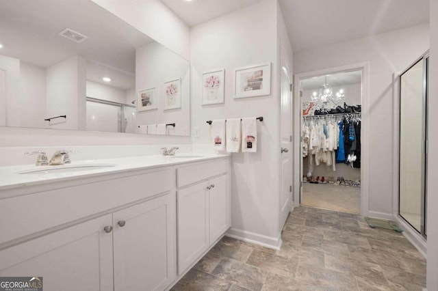 108 Berwick Xing, Dallas, GA 30157 - full bathroom with visible vents, baseboards, a sink, a stall shower, and a notable chandelier