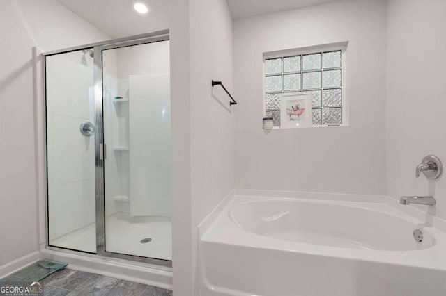 108 Berwick Xing, Dallas, GA 30157 - full bath with a garden tub, baseboards, and a stall shower