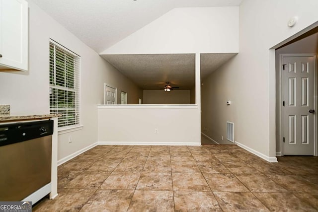 interior space featuring visible vents, ceiling fan, a textured ceiling, tile patterned floors, and vaulted ceiling