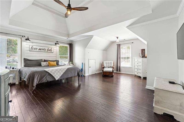 bedroom featuring wood-type flooring, multiple windows, and lofted ceiling