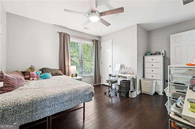 bedroom featuring ceiling fan, dark wood-style flooring, and visible vents