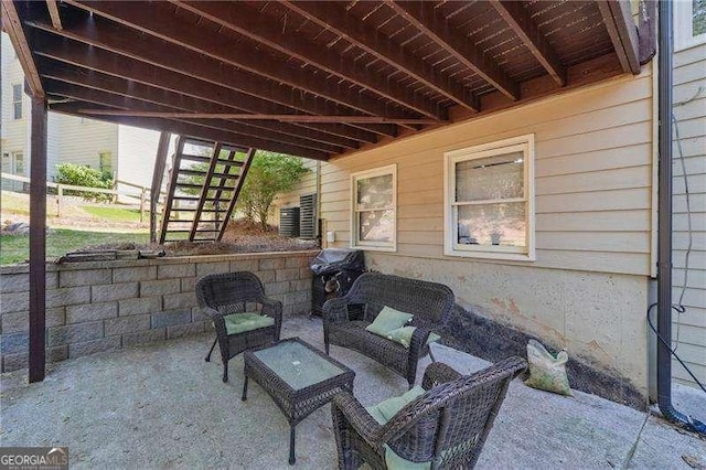 view of patio / terrace with stairway, outdoor lounge area, and area for grilling