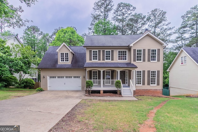 view of front of house with covered porch, an attached garage, concrete driveway, and a front lawn