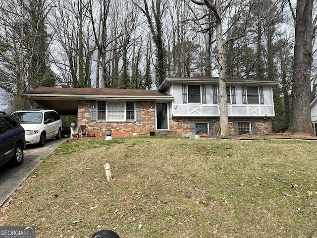 8474 Magnolia Dr, Jonesboro, GA 30238 - split level home with an attached carport, brick siding, a front lawn, and aphalt driveway