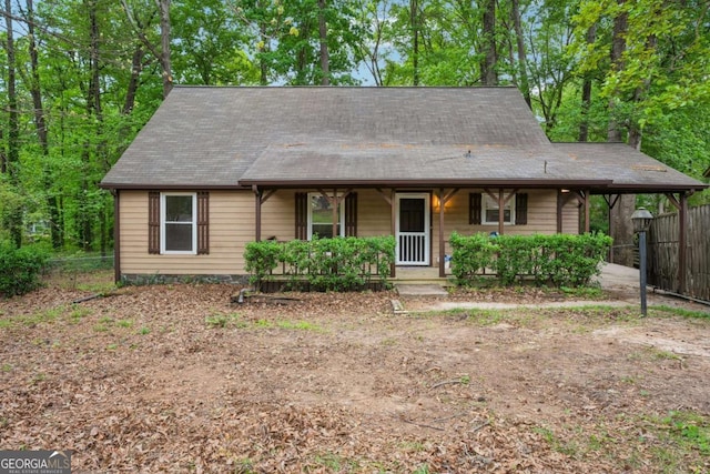 6693 Doublegate Ln, Rex, GA 30273 - view of front of property with a porch, fence, and a carport