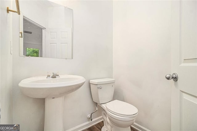 7454 Silver Arrow Trl SE, Austell, GA 30168 - half bath featuring baseboards and wood finished floors