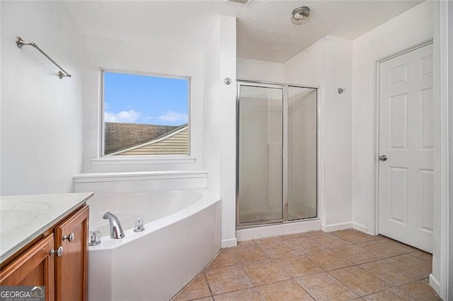 7454 Silver Arrow Trl SE, Austell, GA 30168 - full bath with a bath, a shower stall, vanity, and a textured ceiling