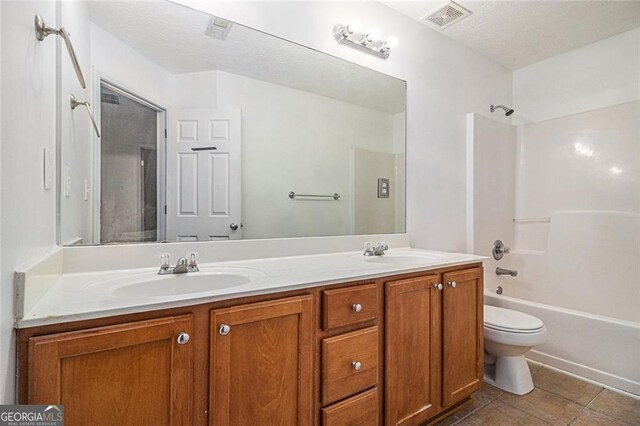 7454 Silver Arrow Trl SE, Austell, GA 30168 - bathroom with double vanity, tile patterned flooring, and washtub / shower combination