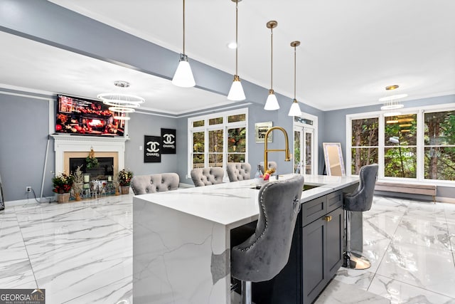 1114 Ivey Chase Pl, Dacula, GA 30019 - kitchen with crown molding, light marble finish floors, a chandelier, light stone counters, and open floor plan