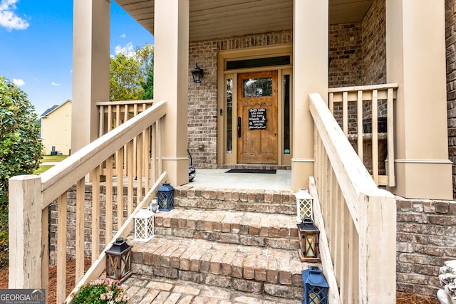 1114 Ivey Chase Pl, Dacula, GA 30019 - entrance to property featuring covered porch and brick siding