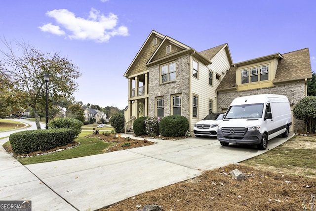 1114 Ivey Chase Pl, Dacula, GA 30019 - view of front of home with driveway, brick siding, and roof with shingles