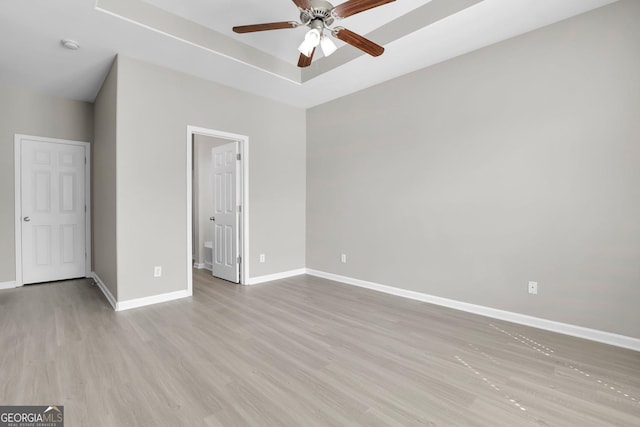 unfurnished bedroom with baseboards and wood finished floors
