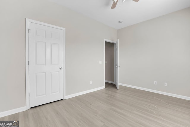 unfurnished bedroom with light wood-style floors and baseboards