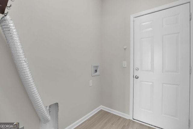 laundry room featuring laundry area, washer hookup, light wood finished floors, baseboards, and hookup for an electric dryer