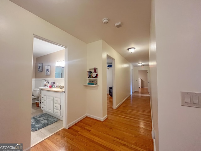 corridor with light wood finished floors