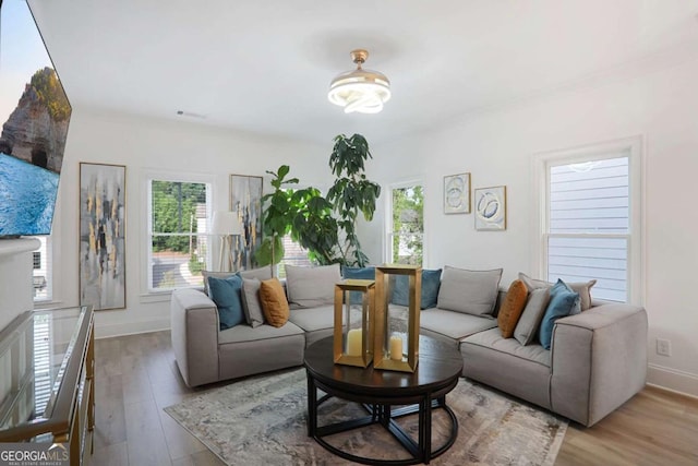 3272 Stillwood Dr, Atlanta, GA 30354 - living area with baseboards, wood finished floors, and visible vents