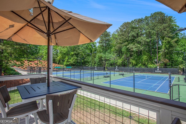 view of tennis court with fence