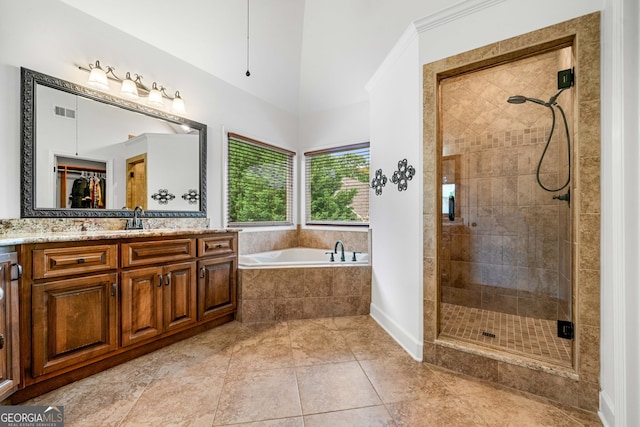 full bathroom with a bath, visible vents, a stall shower, vanity, and tile patterned floors