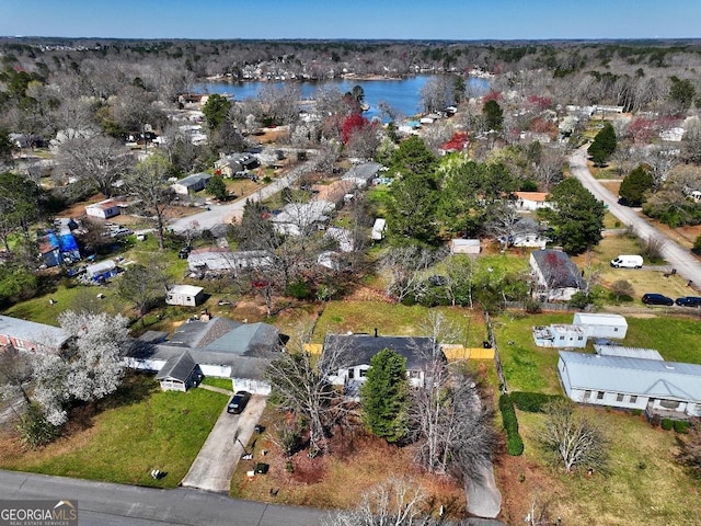 birds eye view of property featuring a residential view and a water view
