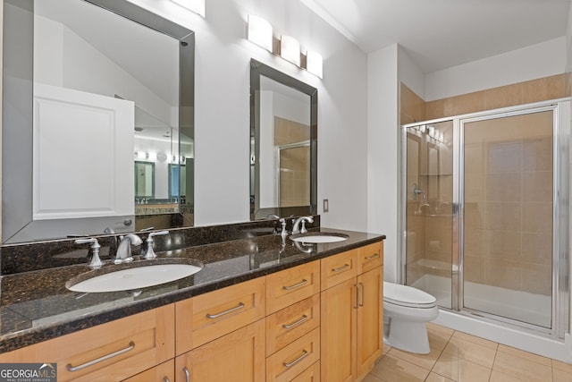 full bath with a sink, tile patterned floors, and a shower stall