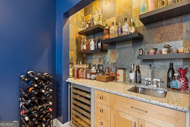bar featuring indoor wet bar, a sink, decorative backsplash, and wine cooler