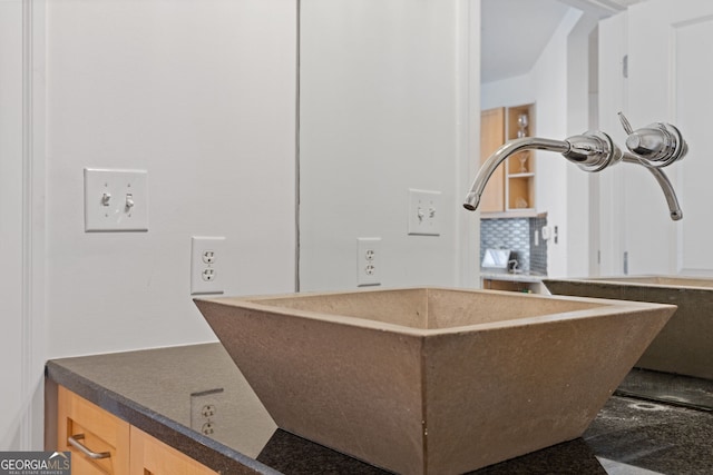 room details with a sink and tasteful backsplash