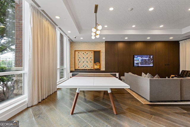 325 E Paces Ferry Rd NE Unit 602, Atlanta, GA 30305 - rec room with a raised ceiling, healthy amount of natural light, wood finished floors, and recessed lighting