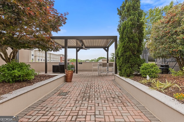 surrounding community with a patio area and area for grilling