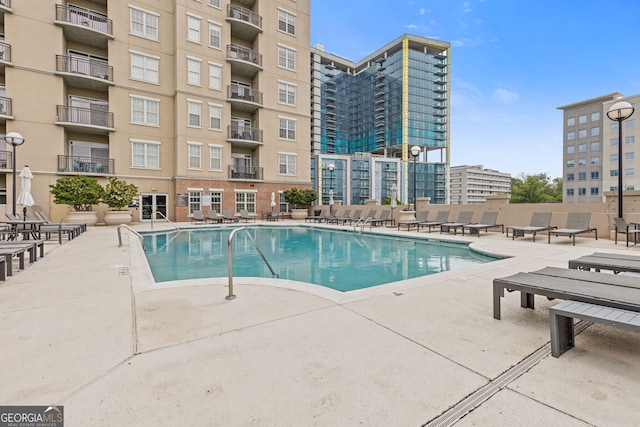 community pool with a patio